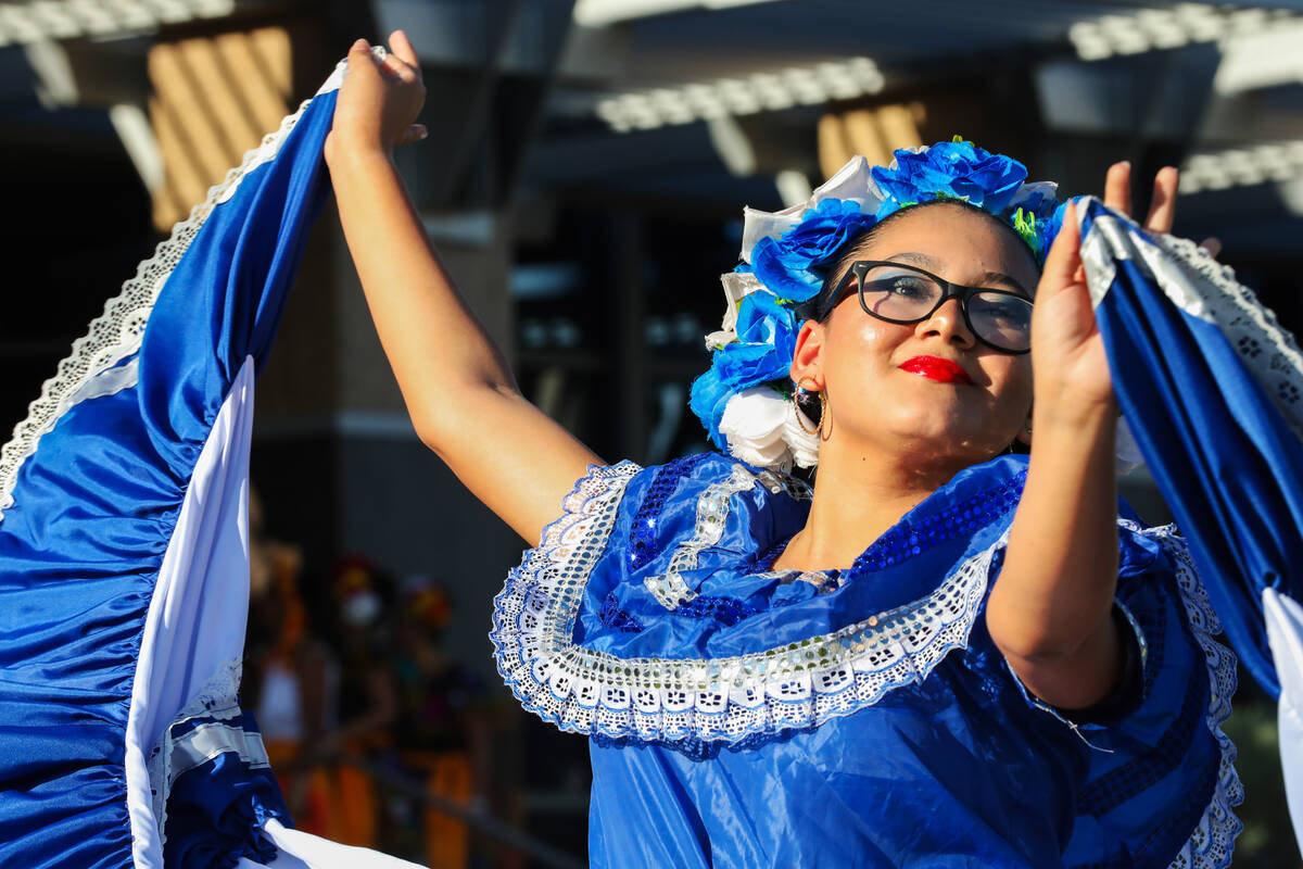 Lady in blue dress dancing at UNLV diversity event